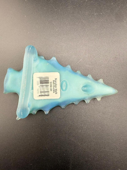 Brando Glass Belt Buckle - Light Blue Sandblasted Arrowhead w/ Mountain & Forest Scene showcased on dark background.