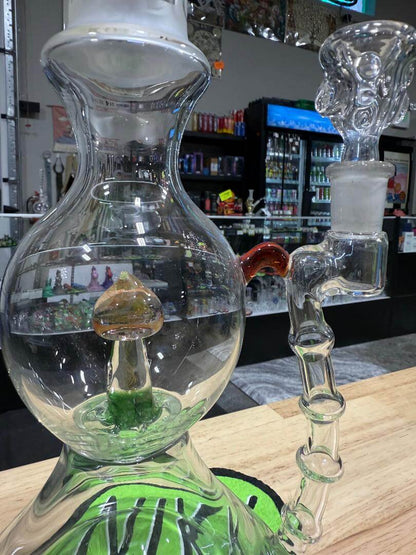 Brando Glass Blooper - Pacific North West Theme Lrg Heavy Fumed 14mm 90° displayed in a shop setting with intricate design.