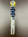 Brando Glass Dab Tool - Mushroom Topped & Cold Worked Tip Yellow Blue & Green on a black background.