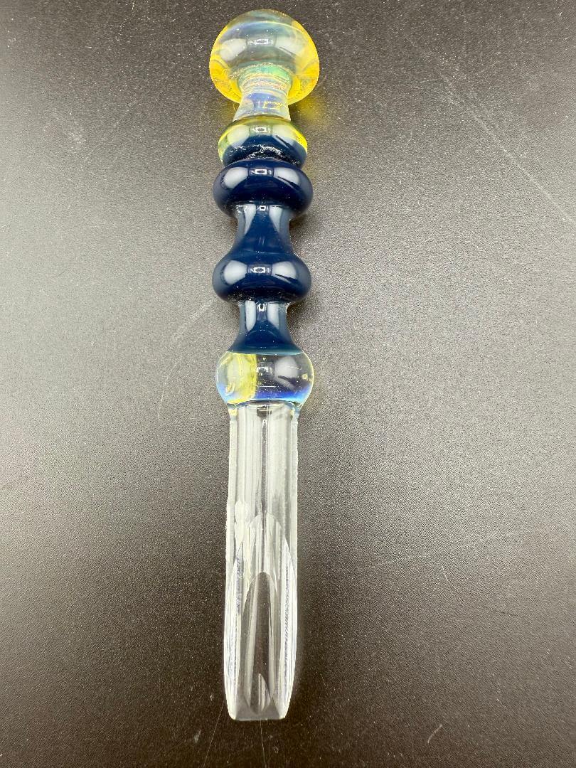 Brando Glass Dab Tool - Mushroom Topped & Cold Worked Tip Yellow Blue & Green on a black background.