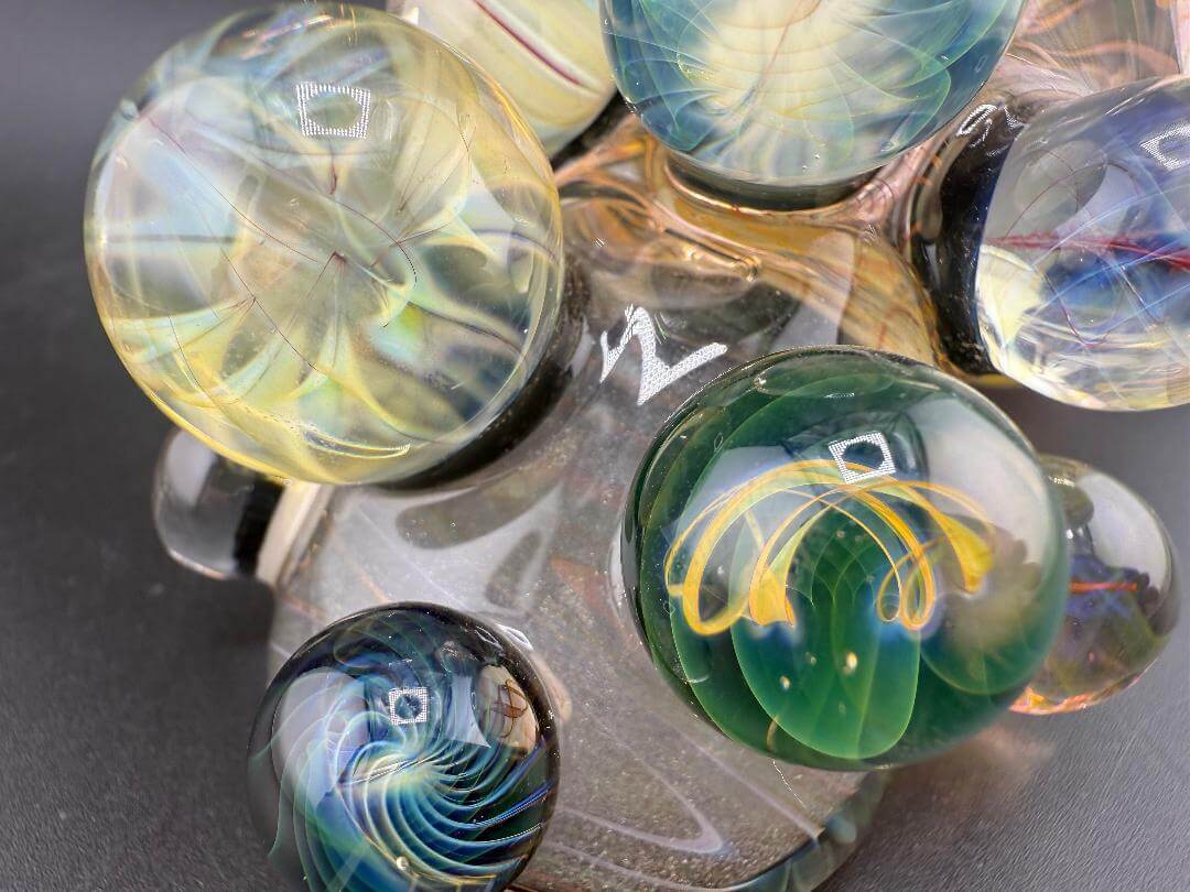 Brando Glass X Doc Glass Sidecar Pipe - Full Gold Fume Glitter Liquid Filled w/ Implosion Marble & Chip Stack Millie Tile detail.