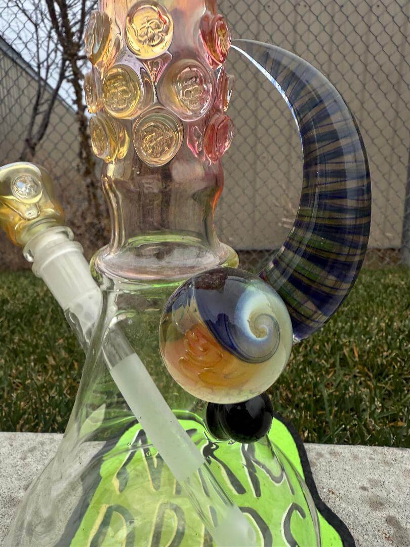Brando Glass Flower Beaker - 18" Fumed Neck Line Worked Horn 14mm 45° showcasing colorful details and unique design.