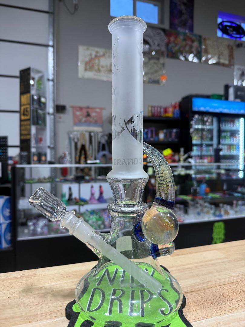 Brando Glass Flower Beaker - Sand Blasted Elf Forest Scene 14mm 45° displayed in a glass shop.