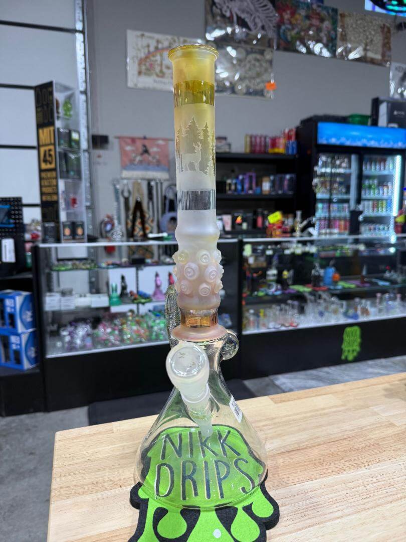 Brando Glass Flower Beaker - Sandblasted & Fumed Elk Forest Scene 14mm 45° displayed in a shop with unique design.