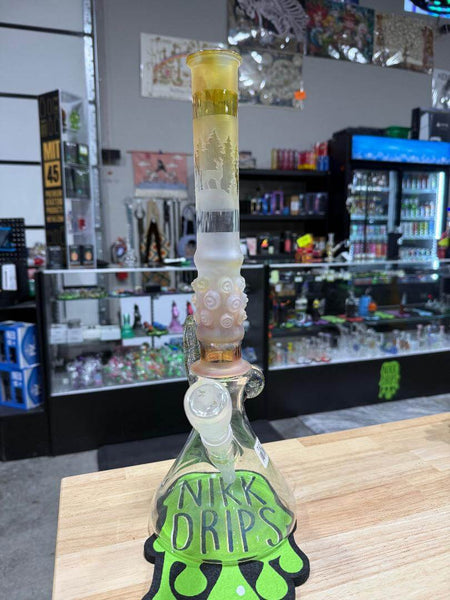 Brando Glass Flower Beaker - Sandblasted & Fumed Elk Forest Scene 14mm 45° displayed in a shop with unique design.