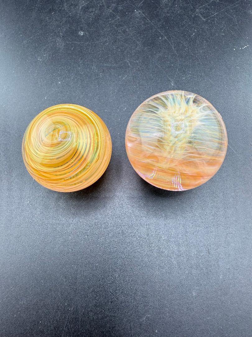 Brando Glass Gold Fumed Marble 1.3" handcrafted marbles showcasing vibrant colors and artistic swirls.