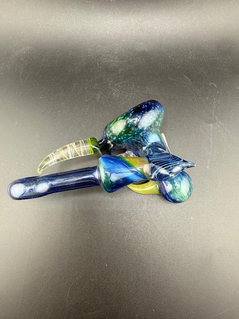 Brando Glass Hammer Pipe - Space Tech w/ Fumed Horns displayed from above on a dark surface.