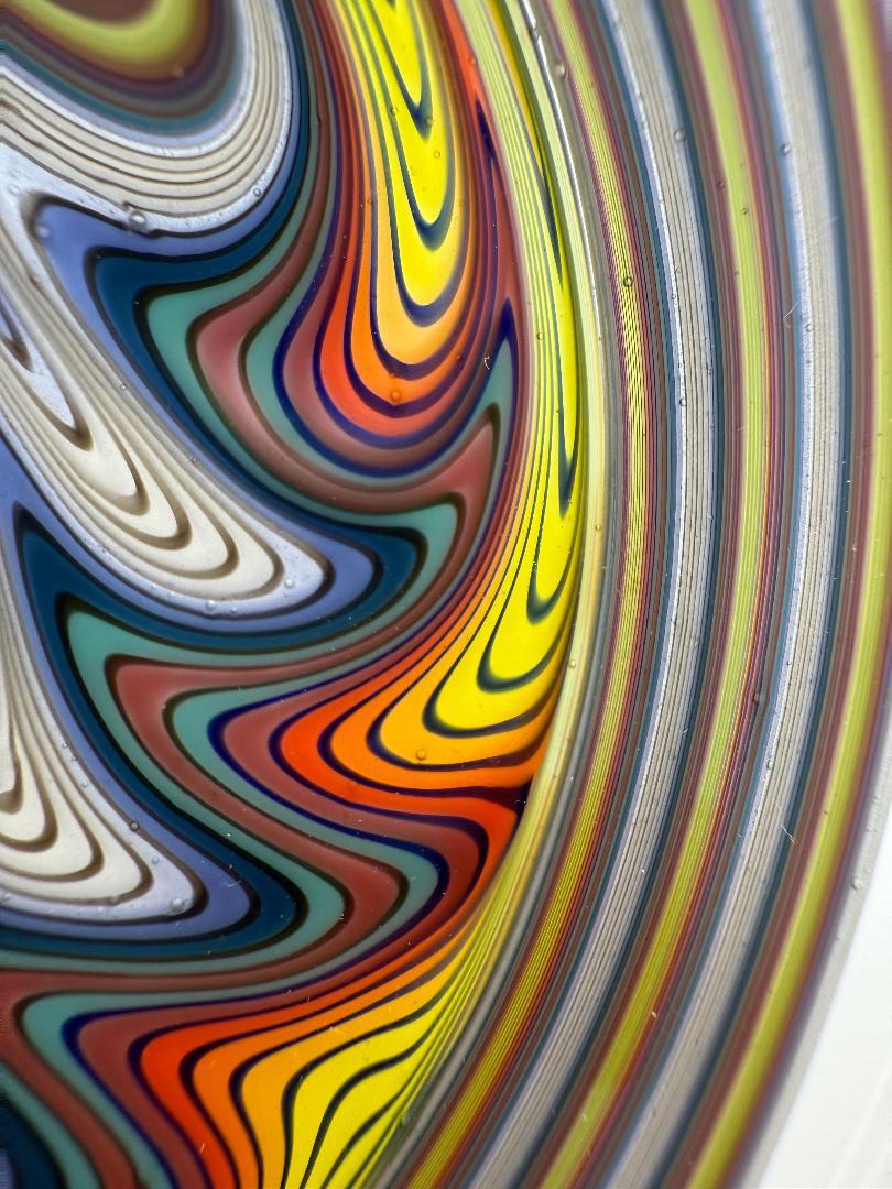 Intricate colors and patterns of the Brando Glass x Joe Hamilton Glass Skull Wig Wag 10mm 90° heady glass piece.