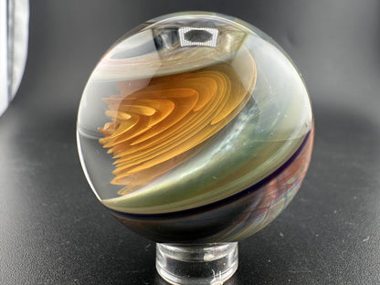 Brando Glass Large Marble - Swirled Backed Implosion showcasing intricate colors and implosion design.