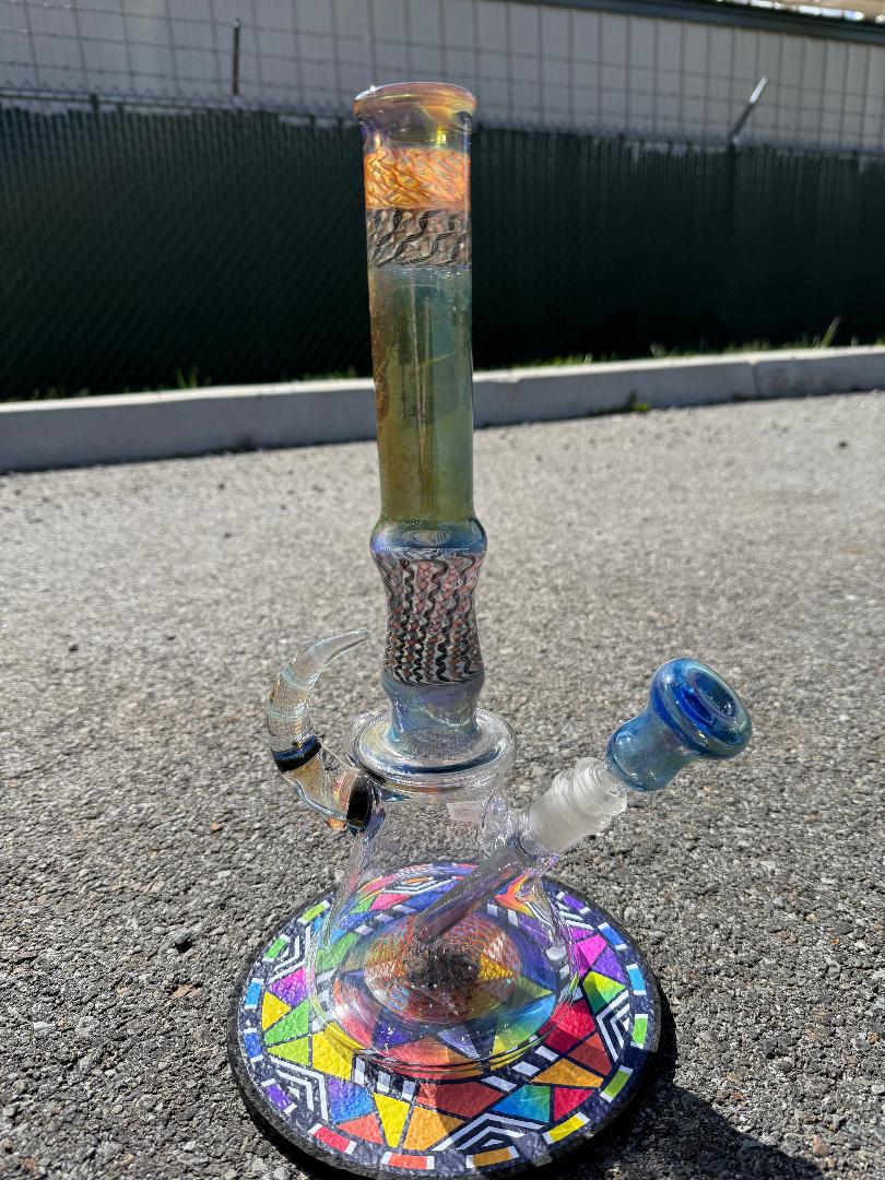 Brando Glass x Luke The Drifter 14mm beaker with colorful design, handcrafted in Spokane, WA, featuring intricate linework.