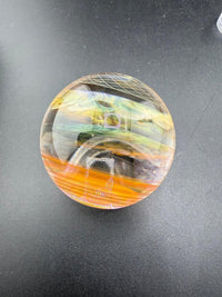 Brando Glass Marble - 16mm Triple Layer Fumed showcasing vibrant colors and intricate designs.
