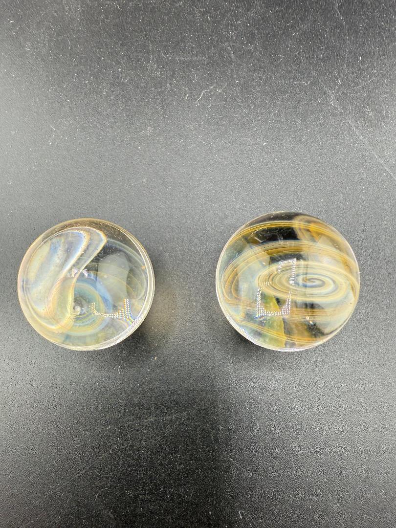 Brando Glass Marble - 21mm Fumed Slurper Top Marble showcasing swirling golden tones and elegant design.