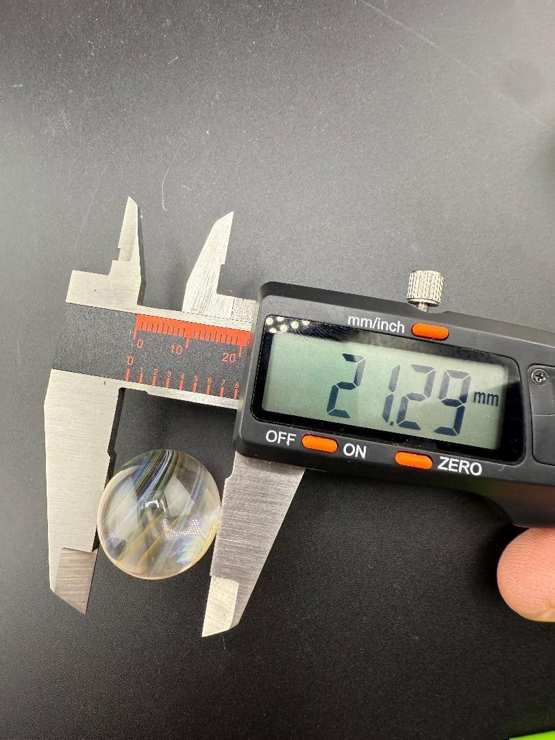 Brando Glass Marble - 21mm Fumed Slurper Top Marble being measured with calipers at 21.29mm.