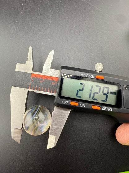 Brando Glass Marble - 21mm Fumed Slurper Top Marble being measured with calipers at 21.29mm.