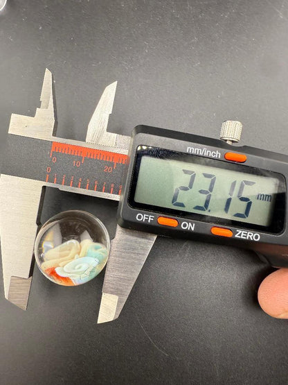 Brando Glass Marble - 23mm Flower Implosion Slurper Top Marble measuring 23.15mm using calipers.