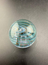 Brando Glass Marble - 34mm Blue & Teal Line Work Over Clear Marble on a black background.