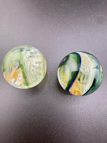 Brando Glass Marble - Double Vortex Approx. 1.15" showcasing intricate vortex designs and vibrant colors.