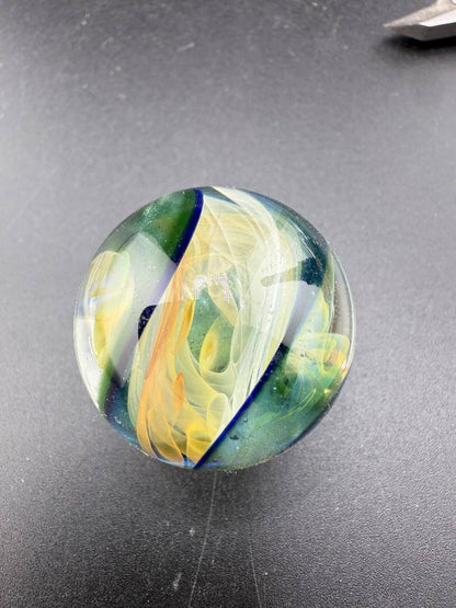 Brando Glass Marble - Double Vortex Approx. 1.15" showcasing vibrant colors and intricate designs.