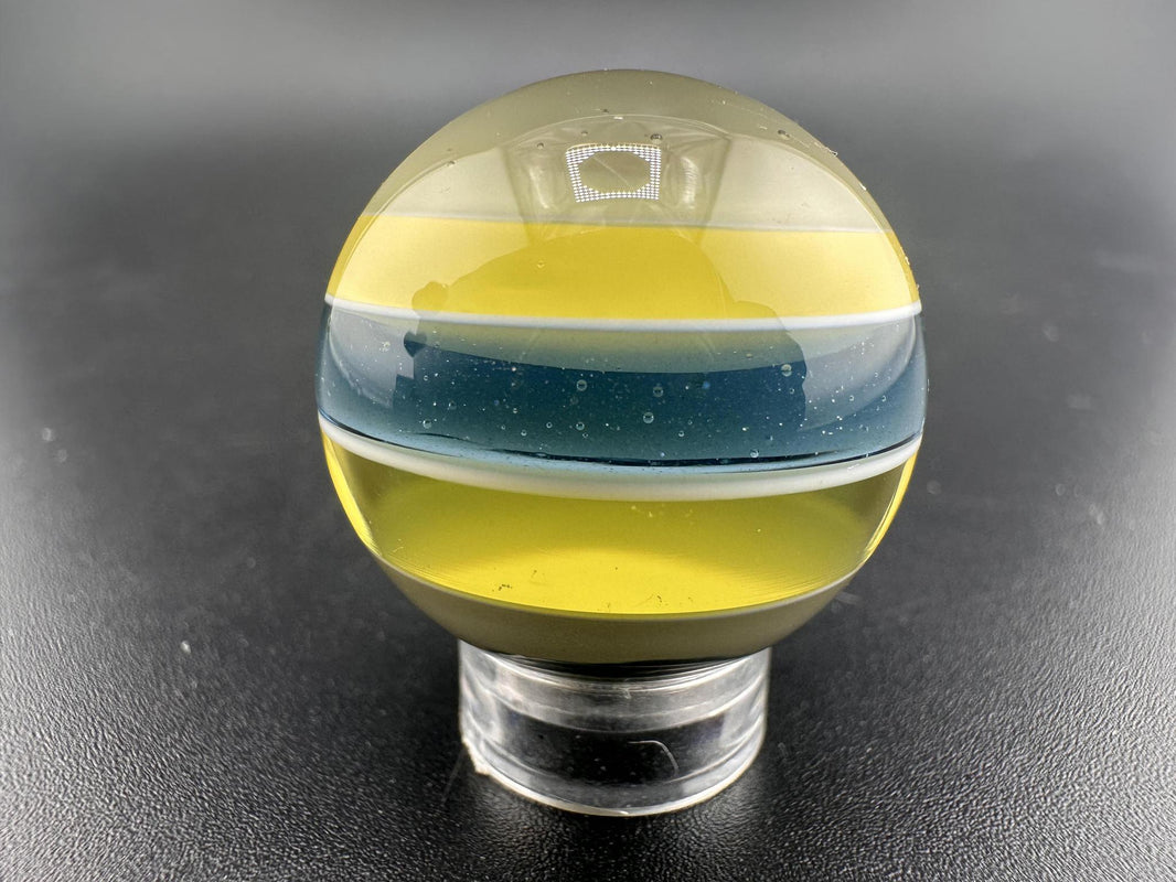 Brando Glass Marble - Enclamo showcasing vibrant layered design in high-quality borosilicate glass.