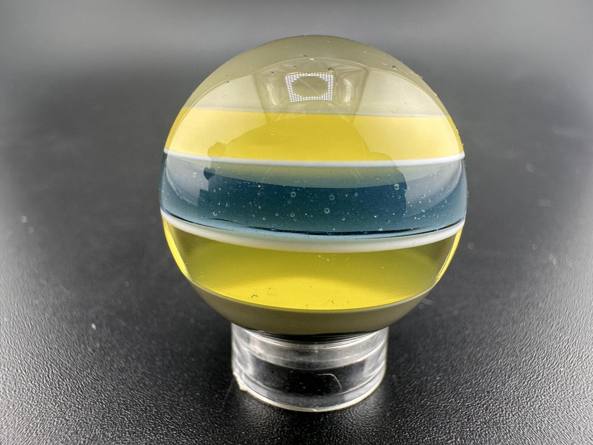 Brando Glass Marble - Enclamo showcasing vibrant layered design in high-quality borosilicate glass.