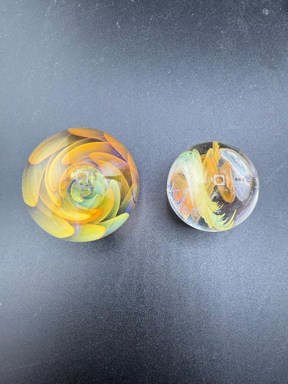 Brando Glass Marble - Fumed Implosion featuring vibrant colors and intricate designs, measuring 1.1"–1.4".