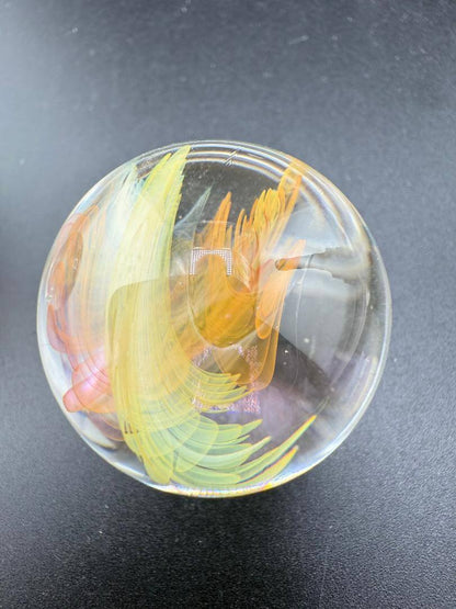 Brando Glass Marble - Fumed Implosion showcasing vibrant colors and swirling design, 1.1"–1.4", handcrafted.