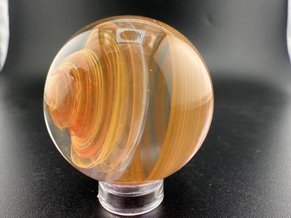 Brando Glass Marble - Fumed Swirl, handcrafted marble with swirling gold and silver hues, 1 inch in diameter.