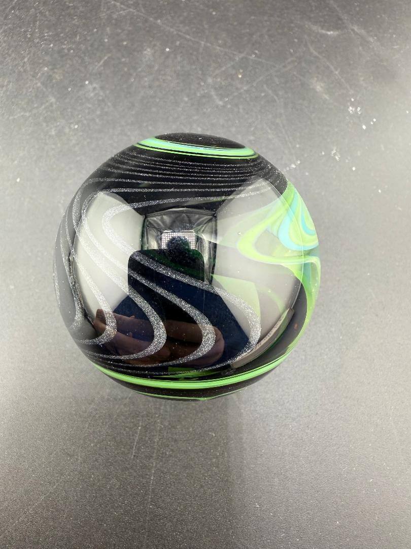 Brando Glass Marble - UV Green Fully Line Worked Twist 1.8" showcasing vibrant spiral design and unique colors.