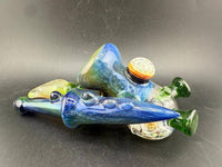 Brando Glass X Micahmazing Sidecar Pipe -Space Fume Tech & Liquid Filled placed artistically on a black background.