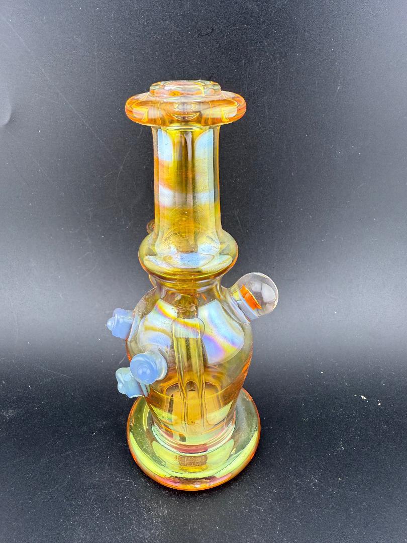 Brando Glass Mini Fumed Moon Shine Jug Rig 10mm 90° w/ Mille Attachment featuring an intricate color-shifting design.