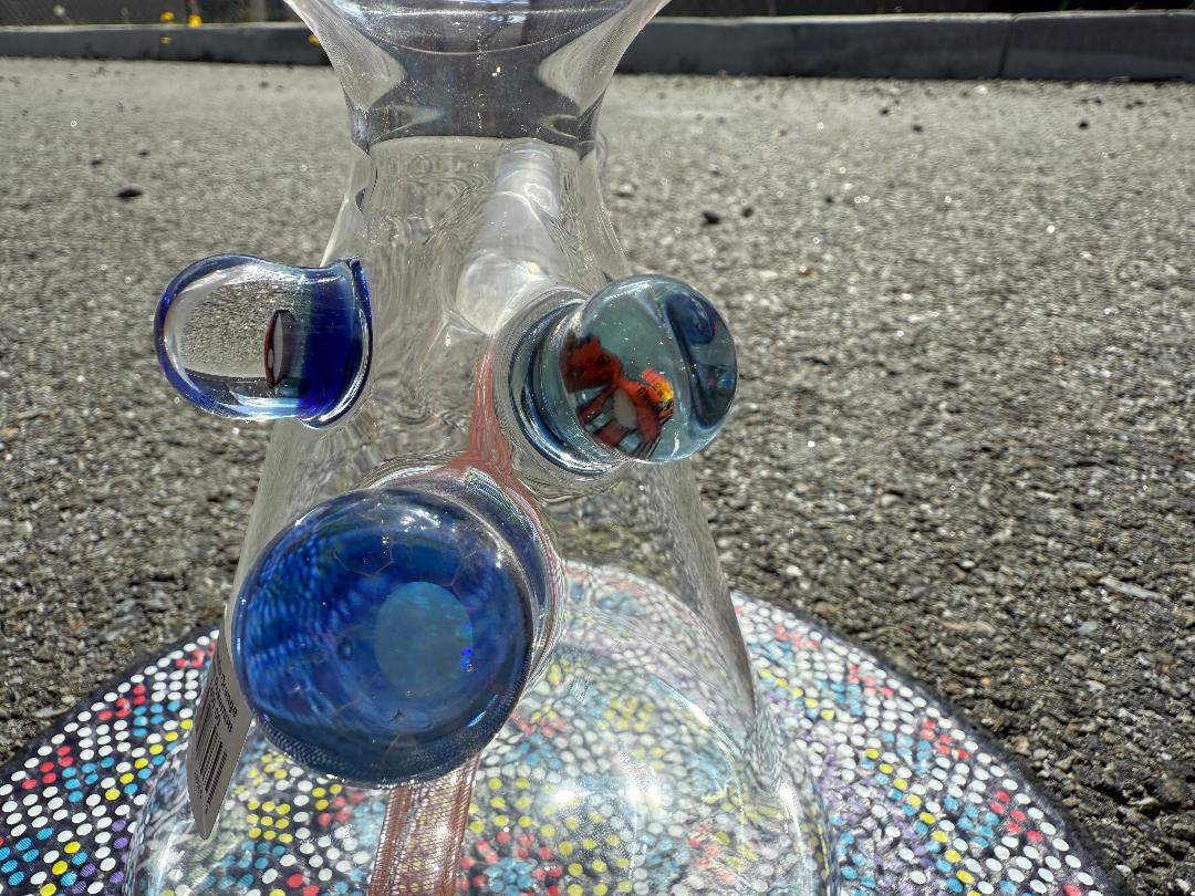 Brando Glass Orange Reticello Pokémon Milli Tube 10mm with vibrant blue accents and Pokémon milli detail.