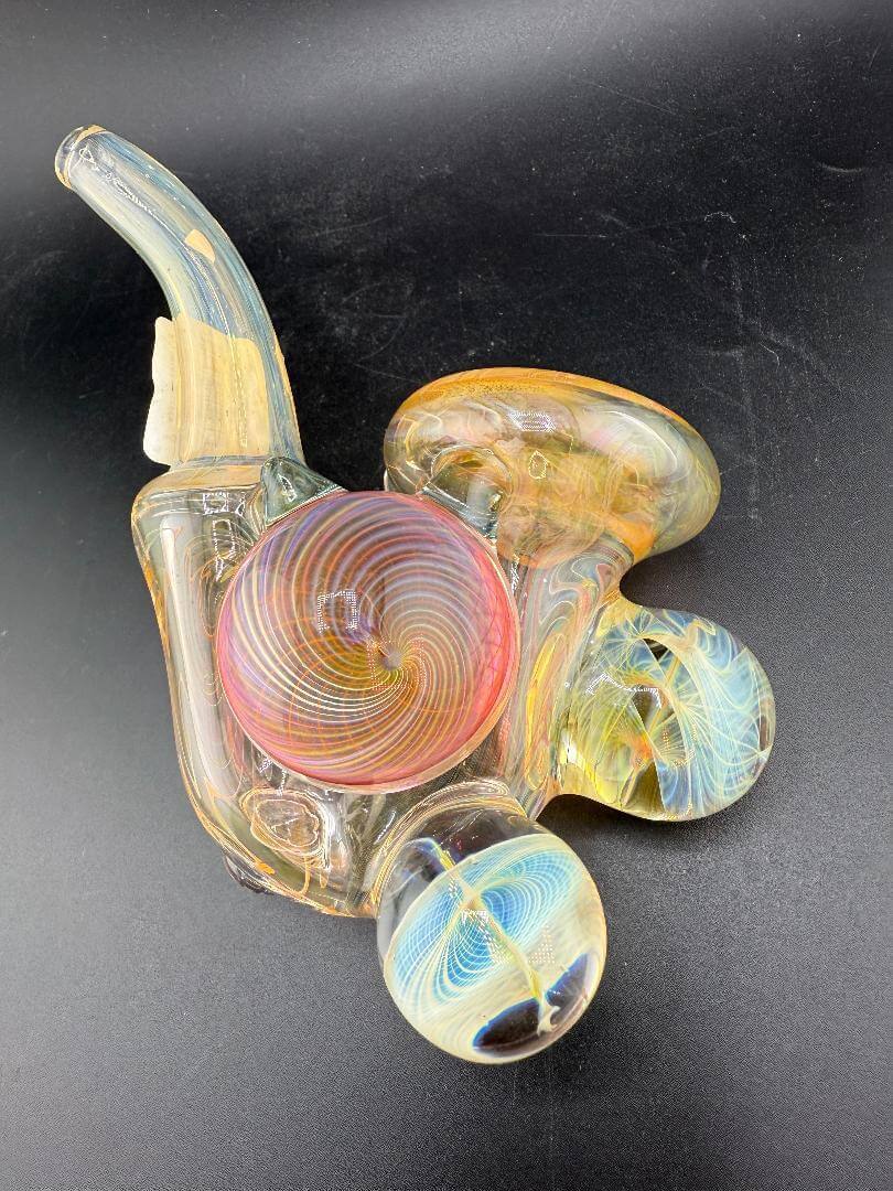 Brando Glass Sherlock Pipe - Gold Fumed w/ Fillacello Marble Attachments showcasing vibrant swirling colors and elegant design.