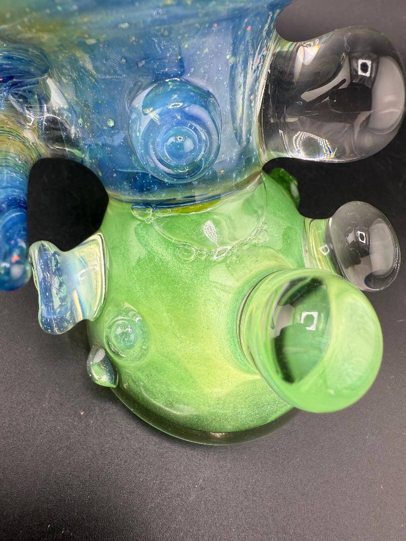 Brando Glass Sidecar Pipe - Space Fume Tech  Green Sparkle Liquid Filled w/ Horn & Marble Attachments showing detailed glasswork.