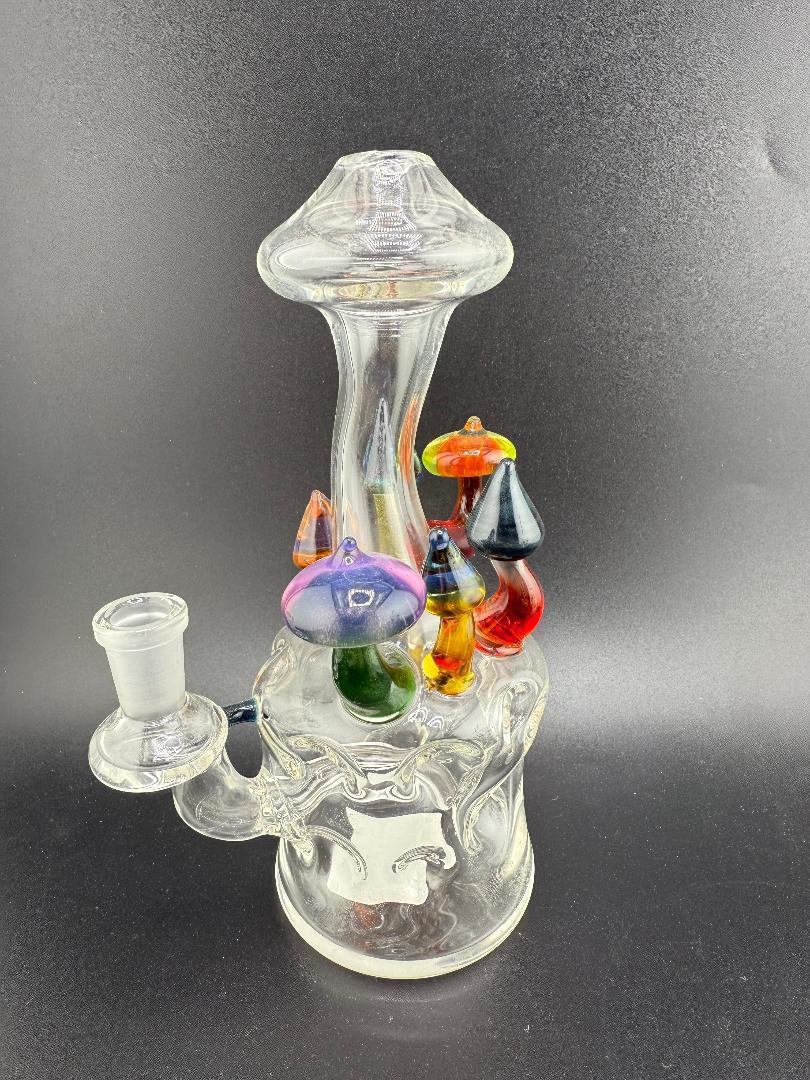 Brando Glass Swiss Cheese (Moon Crater) Rig – 10mm 90° hand-blown glass rig featuring colorful mushroom accents.