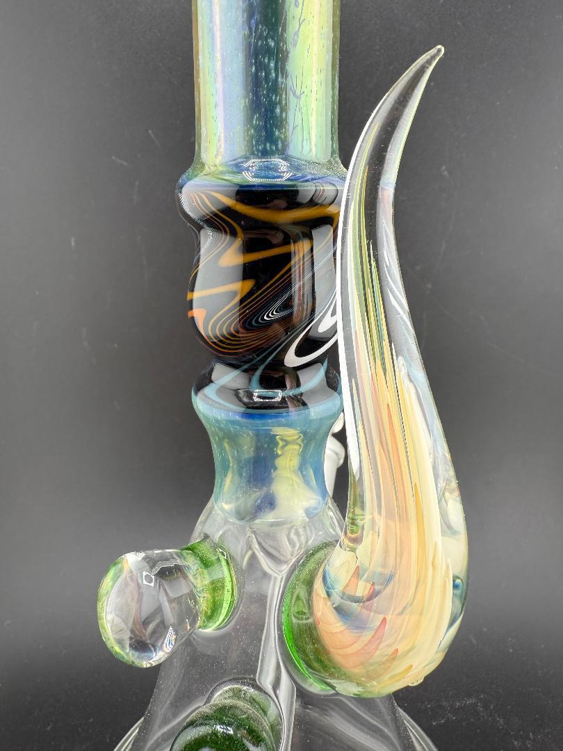 Brando Glass Wig Wag Space Tech Beaker in black and orange, handcrafted American glass water pipe, showcasing intricate design details.