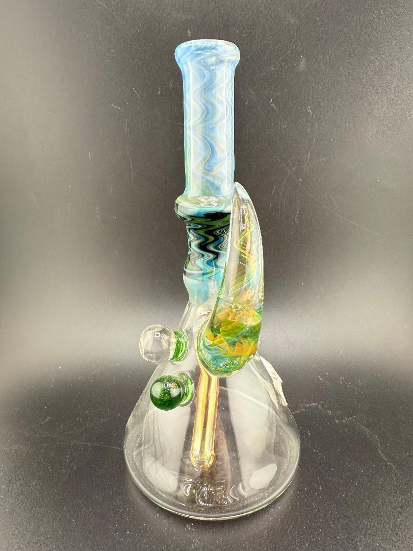 Brando Glass Wig Wag Space Tech Beaker in green and blue, handmade American glass with vibrant design.