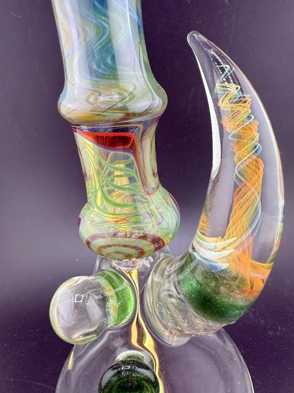 Brando Glass Wig Wag Space Tech Beaker in green and red, showcasing vibrant colors and intricate craftsmanship.