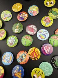 Bucket O Buttons 4pc Mystery Pack featuring various unique button designs including quotes and characters.