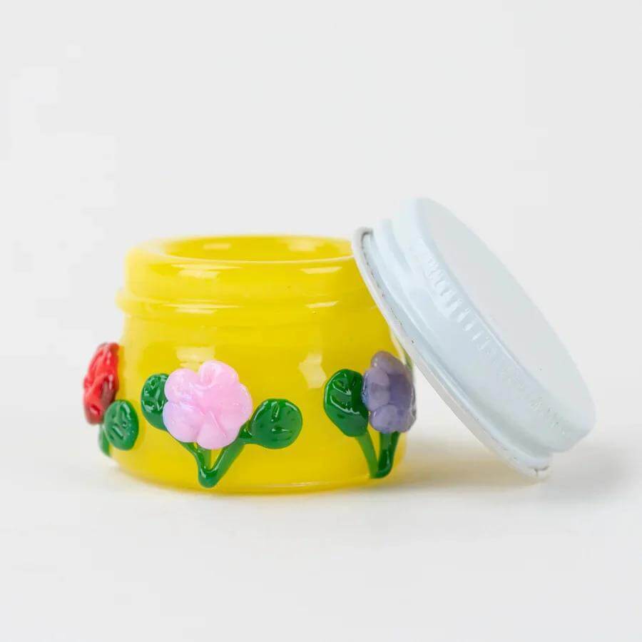 Empire Glassworks Terp Jar in bright yellow with floral design, perfect for preserving terpenes and concentrates.