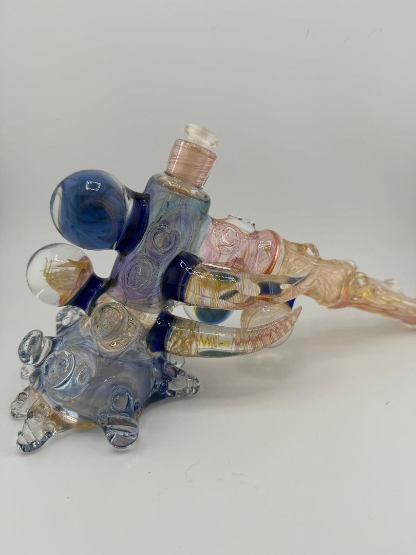 Brando Glass Large Format Fumed Hammer Rig in vibrant fumed colors with artistic design and 10mm joint, perfect for high performance.