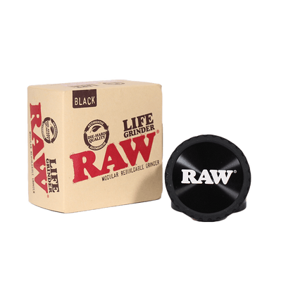 RAW Life Grinder with box, showing high-quality black modular design and branding for enhanced grinding experience.