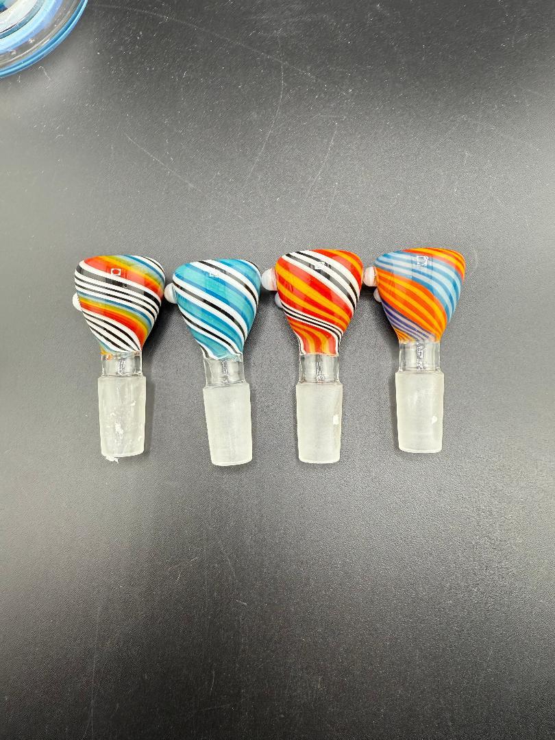 Four Multi Color Swirl 14mm Bowls in vibrant orange, blue, and black patterns on a black surface.