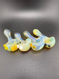 Handcrafted glass pipes with fumed finish and colorful accents, showcasing unique designs by local artists.