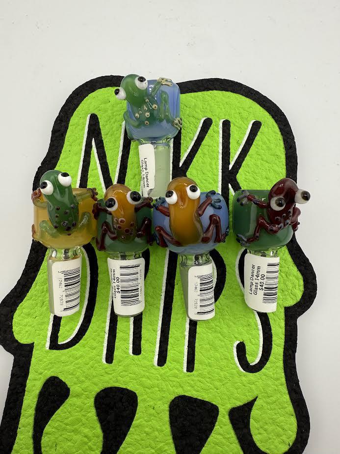 Colorful 14mm frog bowl pieces by Lamp Dancer, showcasing unique designs and vibrant colors on a playful background.