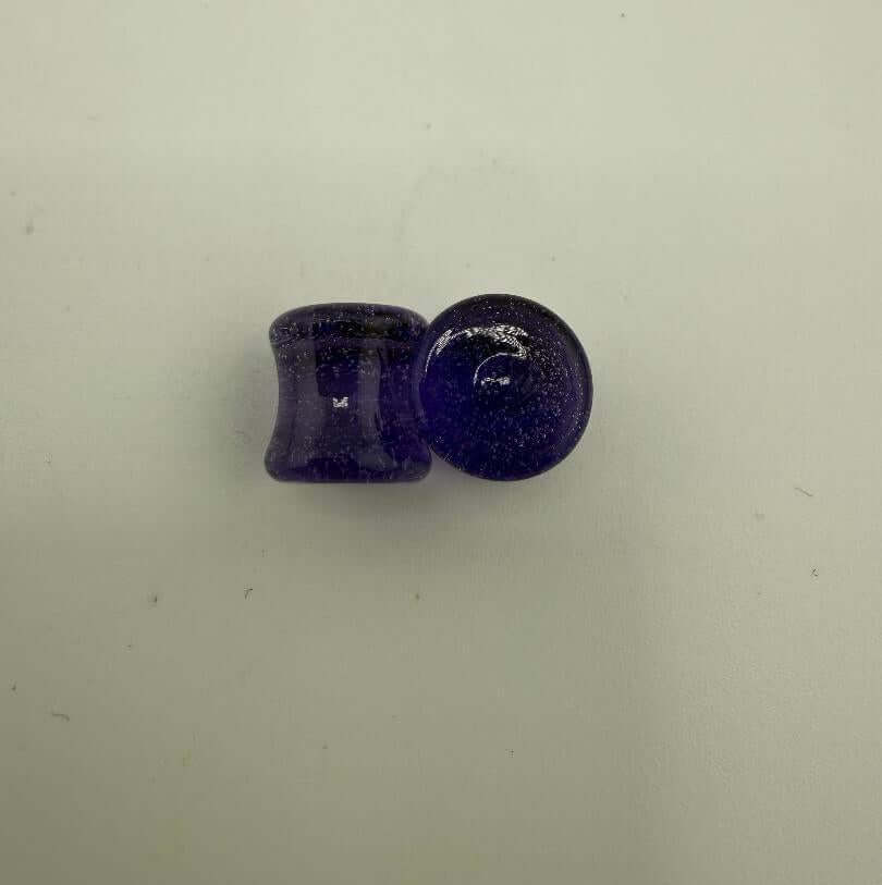 Paulson Pieces 9mm ear plugs made from purple borosilicate glass, showcasing stylish body jewelry craftsmanship.