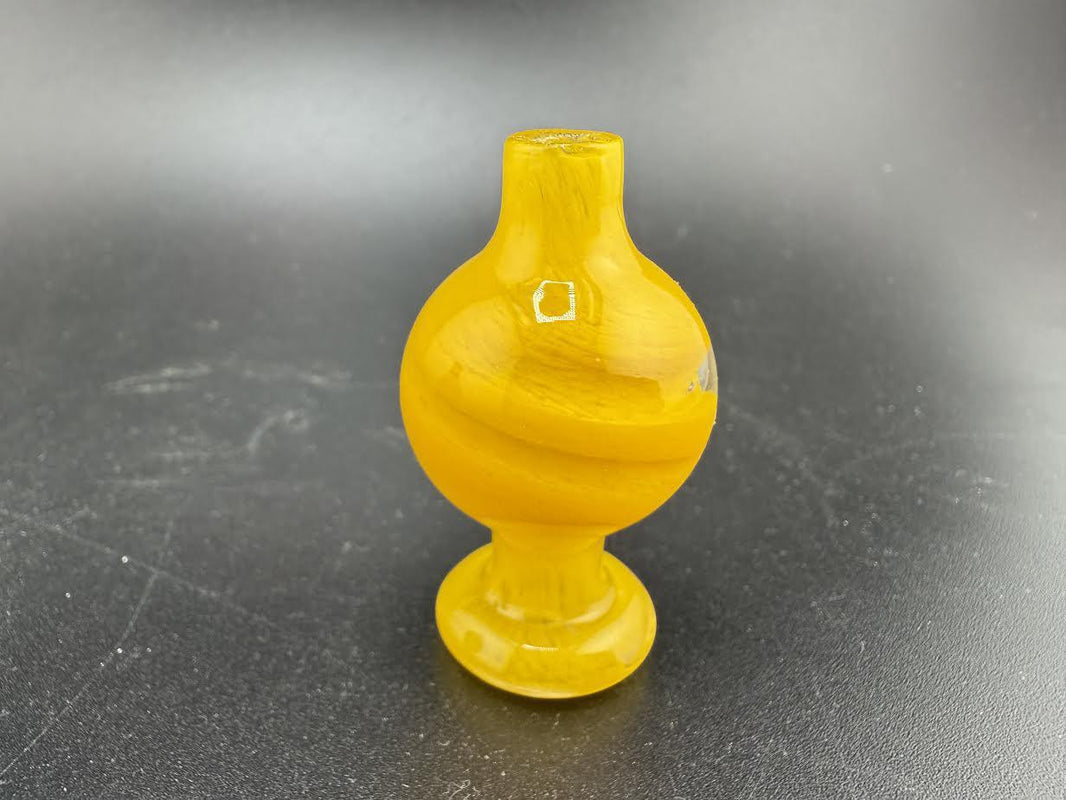 Bright yellow Bolt Up Bubble Cap with a round body and flared base, perfect for enhancing your smoking experience.
