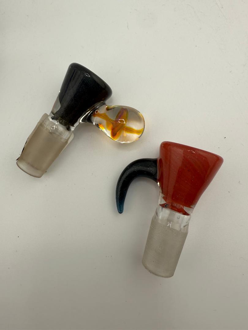 Two Lylo Glass Single Hole Martini Bowls, one black and one red, showcasing unique designs and craftsmanship.