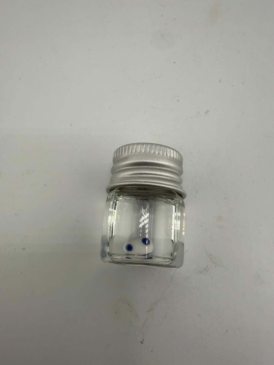 Lucky Gnome Glass Terp Pearl in clear jar with metal lid, featuring blue accents for enhanced dab sessions.