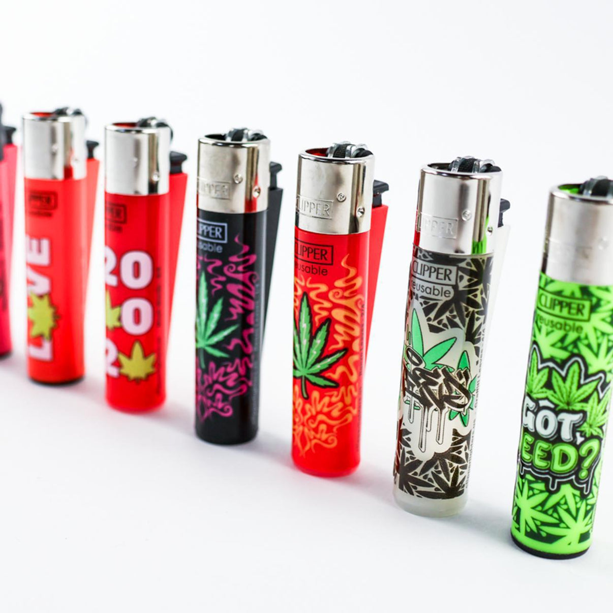 Clipper Lighter - Random designs lined up showcasing colorful styles and unique graphics.