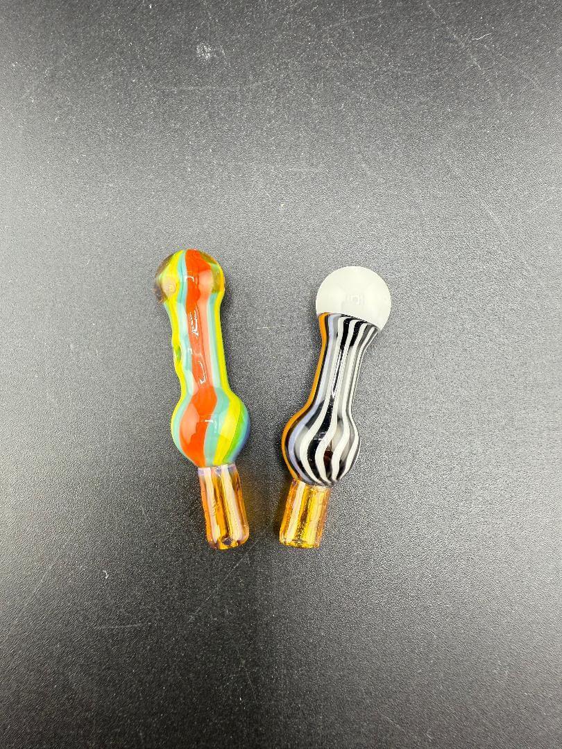 Colorful glass smoking accessories, featuring a striped design and a classic spoon shape, ideal for enjoyable experiences.
